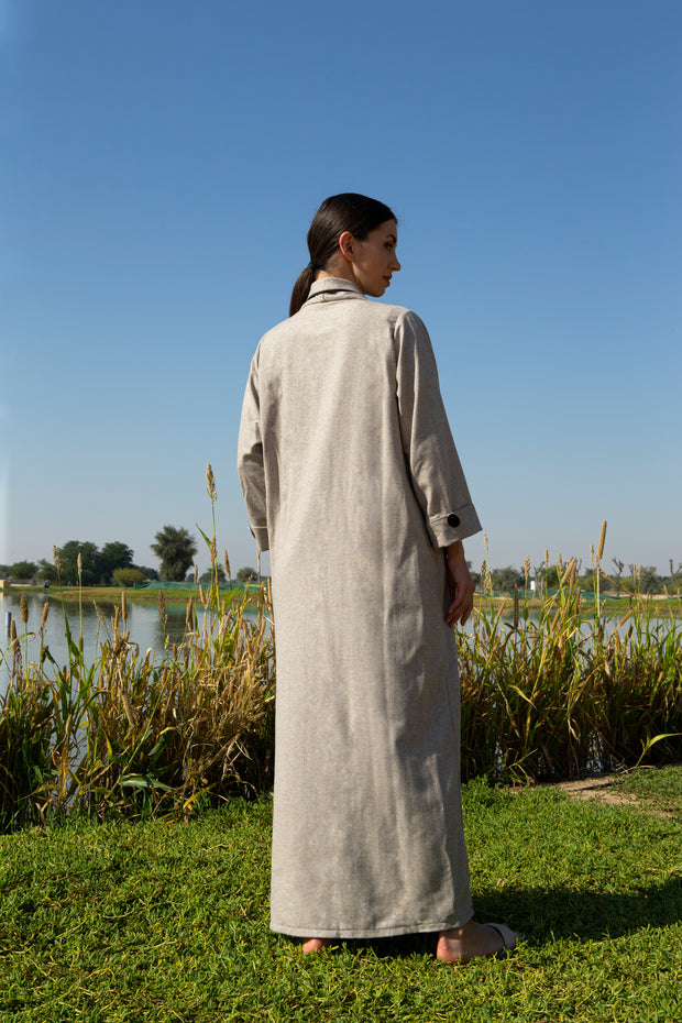 Beige abaya with black piping