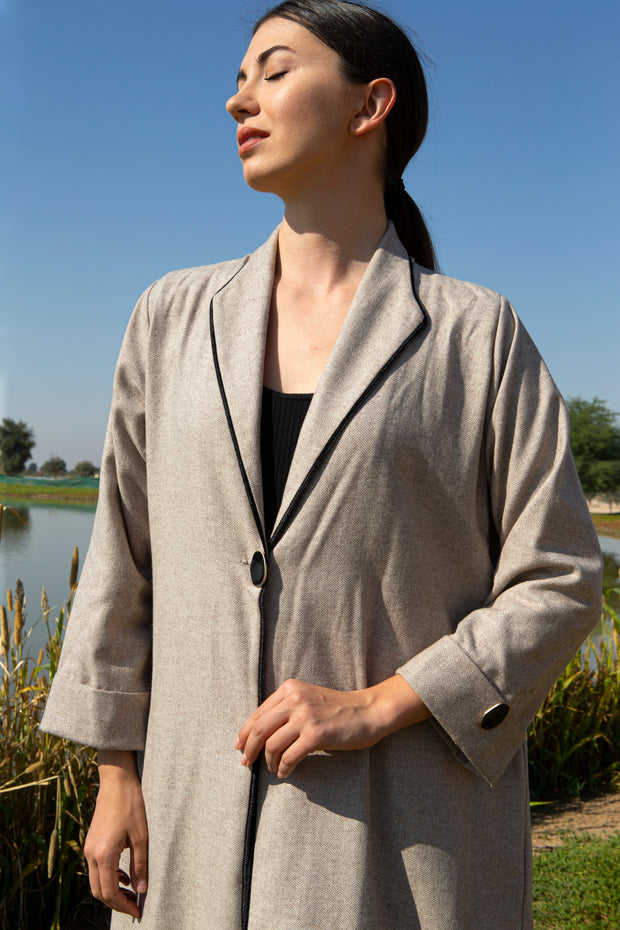 Beige abaya with black piping