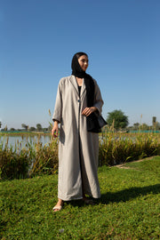 Beige abaya with black piping