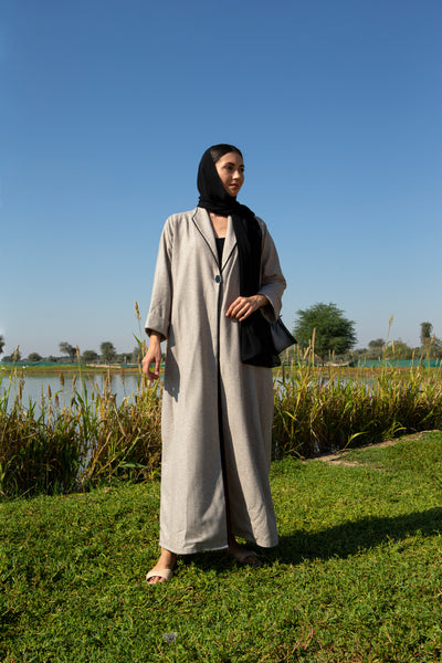 Beige abaya with black piping