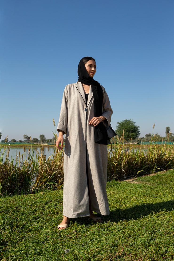 Beige abaya with black piping