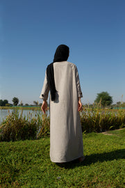 Beige abaya with black piping