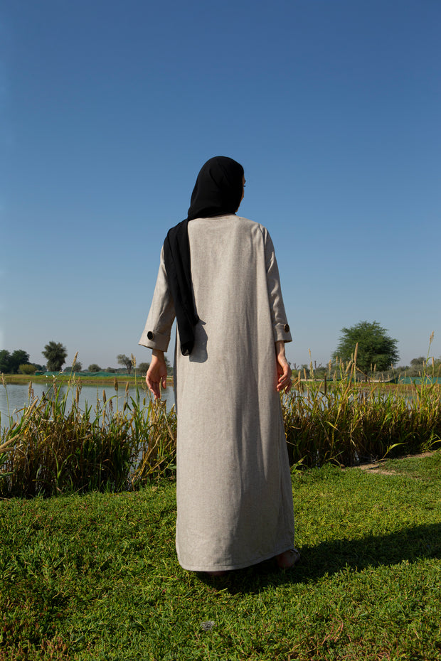 Beige abaya with black piping