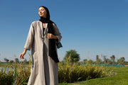Beige abaya with black piping