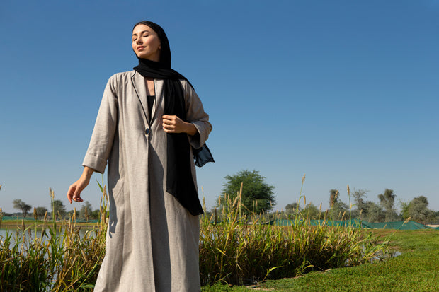 Beige abaya with black piping