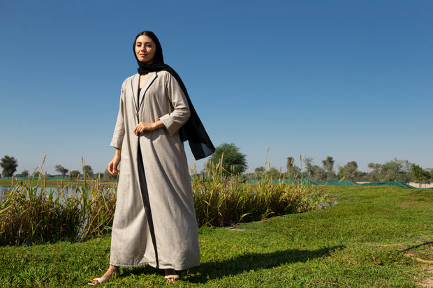Beige abaya with black piping